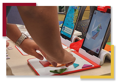 A Leadership Seminar attendee tests out a manipulatives app