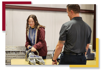 image-14 A GEAR UP student tries out firefighting equipment