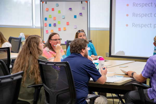Participants engage in a group discussion.